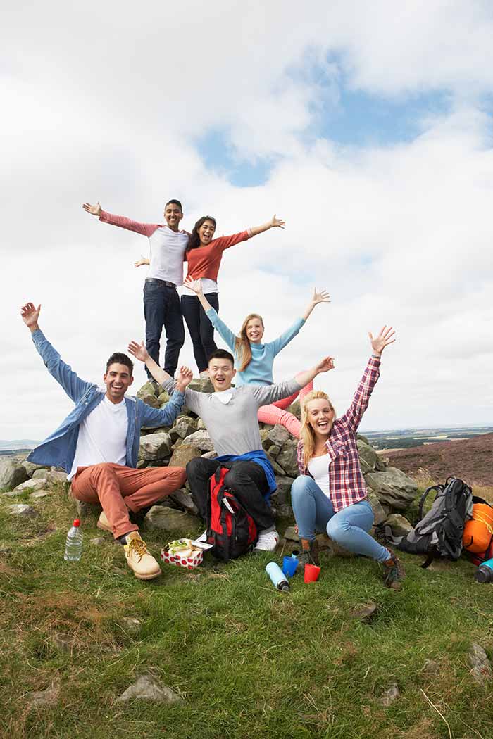 Group of people with hands in air