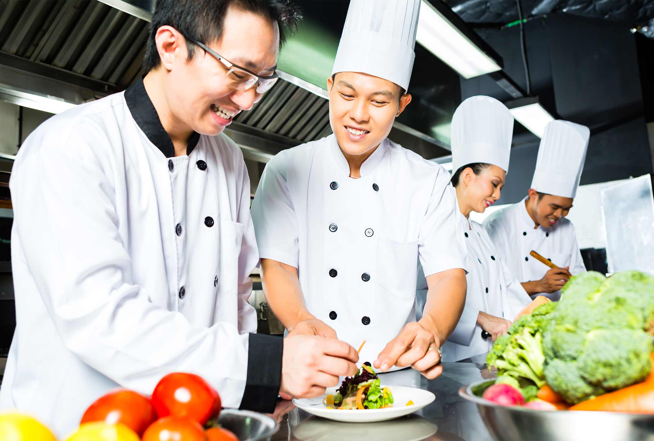 Chefs preparing plates